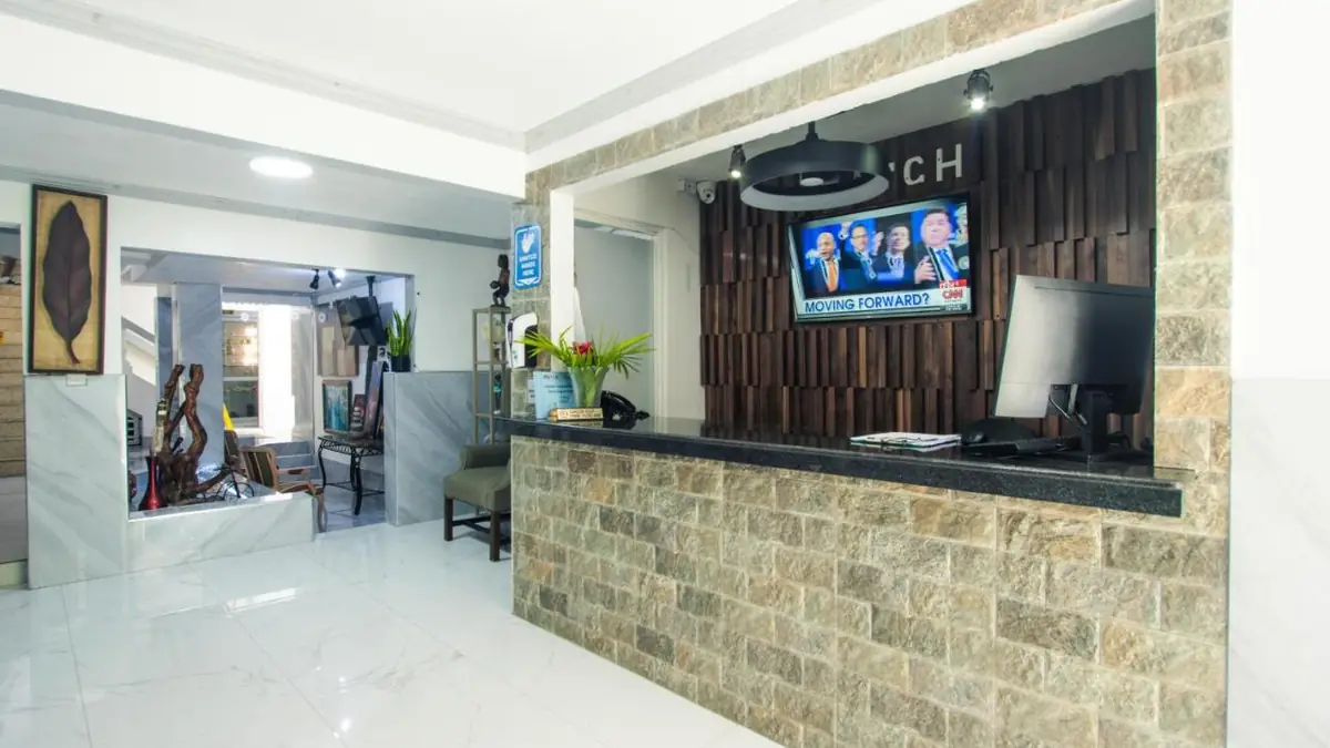 The front desk at The Match Resort, with a stone counter